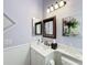 Updated bathroom with white vanity at 15856 Cobble Mill Dr, Wimauma, FL 33598