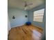 Bedroom with hardwood floors and a ceiling fan at 16103 Muirfield Dr, Odessa, FL 33556