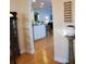 View of kitchen with white cabinets and hardwood floors at 16103 Muirfield Dr, Odessa, FL 33556