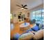 Bright living room with hardwood floors and pool view at 16103 Muirfield Dr, Odessa, FL 33556