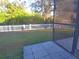 Backyard patio with fence and grassy area at 16103 Muirfield Dr, Odessa, FL 33556