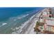 Aerial beach view showcasing oceanfront location and nearby buildings at 16317 Gulf Blvd, Redington Beach, FL 33708