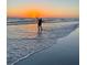 Person enjoying a sunset on a beautiful beach at 16317 Gulf Blvd, Redington Beach, FL 33708