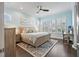 Main bedroom with a light wood bed frame and ocean-themed decor at 16317 Gulf Blvd, Redington Beach, FL 33708