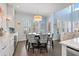 Bright breakfast nook with a round table and patterned chairs, perfect for casual dining at 16317 Gulf Blvd, Redington Beach, FL 33708