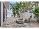 Relaxing patio with fire pit and comfortable seating at 16317 Gulf Blvd, Redington Beach, FL 33708