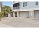 Three-car garage with driveway and landscaping at 16317 Gulf Blvd, Redington Beach, FL 33708