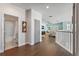 Upstairs hallway with wood floors, bathroom and living area access at 16317 Gulf Blvd, Redington Beach, FL 33708