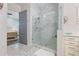 Large walk-in shower with marble tile and glass enclosure at 16317 Gulf Blvd, Redington Beach, FL 33708