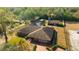 Aerial view showing house, pool, and outbuildings at 1702 S Miller Rd, Valrico, FL 33594