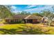 Ranch home with a large front yard and a flagpole at 1702 S Miller Rd, Valrico, FL 33594