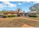 Brick home with fenced pool and screened enclosure at 1702 S Miller Rd, Valrico, FL 33594