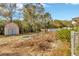 Backyard with shed and wood pile at 1702 S Miller Rd, Valrico, FL 33594