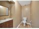 Clean bathroom with wood vanity and tile floor at 1702 S Miller Rd, Valrico, FL 33594