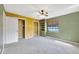 Bedroom with double closets and ceiling fan at 1702 S Miller Rd, Valrico, FL 33594