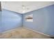 Light blue walls and neutral carpeting in this bedroom at 1702 S Miller Rd, Valrico, FL 33594