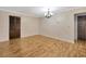 Bright dining room features hardwood floors and a chandelier at 1702 S Miller Rd, Valrico, FL 33594