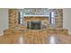 Brick fireplace with a raised hearth and wood mantel at 1702 S Miller Rd, Valrico, FL 33594