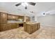 Spacious kitchen with an island and dark wood cabinets at 1702 S Miller Rd, Valrico, FL 33594