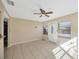 Living room with tile floor, neutral walls, and a ceiling fan at 1702 S Miller Rd, Valrico, FL 33594