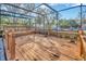 Spacious screened patio with wooden deck at 1702 S Miller Rd, Valrico, FL 33594