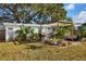 Relaxing backyard oasis with pergola and tropical plants at 1707 Darlington Dr, Tampa, FL 33619