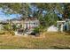 Backyard patio with pergola, grill, and lush landscaping at 1707 Darlington Dr, Tampa, FL 33619