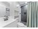 Bathroom with a shower, white vanity, and modern fixtures at 1707 Darlington Dr, Tampa, FL 33619