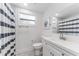 Bathroom with a shower, white vanity, and modern fixtures at 1707 Darlington Dr, Tampa, FL 33619