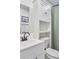 Bathroom with white vanity and linen cabinet at 1707 Darlington Dr, Tampa, FL 33619