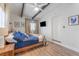 Bedroom with a bed, ceiling fan, wood-look floors, and natural light from the windows at 1707 Darlington Dr, Tampa, FL 33619