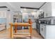 Bright kitchen featuring stainless steel appliances, sleek white cabinets, and a butcher block island at 1707 Darlington Dr, Tampa, FL 33619