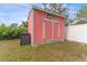 Shed in yard provides extra storage and has unique decorations at 1707 Darlington Dr, Tampa, FL 33619