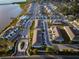 Aerial view of new construction community featuring lake access and meticulously landscaped common areas at 1708 Sunset Wind Loop, Oldsmar, FL 34677