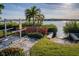 Well-maintained boat ramp providing easy access to the waterway, complemented by lush landscaping at 1708 Sunset Wind Loop, Oldsmar, FL 34677