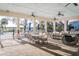 Relaxing outdoor patio with seating areas and a view of the surrounding landscape at 1708 Sunset Wind Loop, Oldsmar, FL 34677