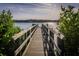 Wooden dock leading to the waterway at 1708 Sunset Wind Loop, Oldsmar, FL 34677