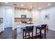 Bright kitchen with a large island, granite countertops, stainless steel appliances, and pendant lighting at 1708 Sunset Wind Loop, Oldsmar, FL 34677