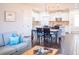 Inviting living room with wood floors open to dining area with views to the bright and modern kitchen at 1708 Sunset Wind Loop, Oldsmar, FL 34677