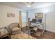 Home office with dark wood floors, an ergonomic chair, and a natural light at 1708 Sunset Wind Loop, Oldsmar, FL 34677