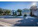 Street view of colorful townhomes with attached garages and palm tree landscaping at 1708 Sunset Wind Loop, Oldsmar, FL 34677