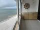 Balcony with ocean view, wet bar, and ship's wheel at 17900 Gulf Blvd # 16C, Redington Shores, FL 33708