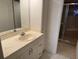 Bathroom with vanity, sink, and shower at 17900 Gulf Blvd # 16C, Redington Shores, FL 33708