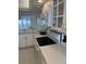 White kitchen with electric stove and microwave at 17900 Gulf Blvd # 16C, Redington Shores, FL 33708