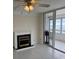 Living room with fireplace and sliding doors to balcony at 17900 Gulf Blvd # 16C, Redington Shores, FL 33708