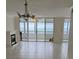 Bright living room with ocean view and fireplace at 17900 Gulf Blvd # 16C, Redington Shores, FL 33708