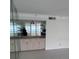 Wet bar with mirrored backsplash and cabinets at 17900 Gulf Blvd # 16C, Redington Shores, FL 33708