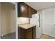 Kitchen with white appliances and wood cabinets at 1799 N Highland Ave # 99, Clearwater, FL 33755