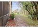 Pathway to pond with lush landscaping at 1801 E Lake Rd # 15C, Palm Harbor, FL 34685