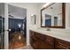 Bathroom with dark wood vanity and quartz countertop at 1801 E Lake Rd # 15C, Palm Harbor, FL 34685